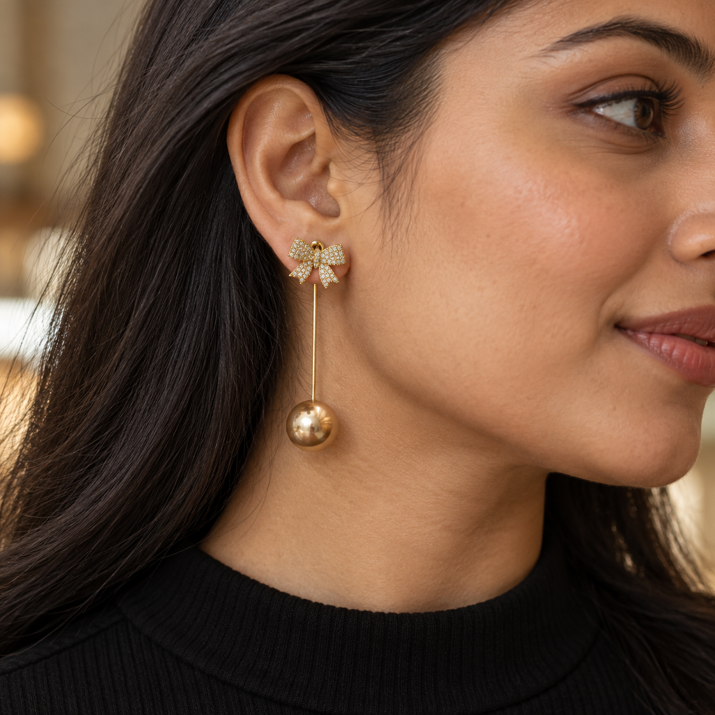 Champagne Bow Long Drop Earrings — worn by model