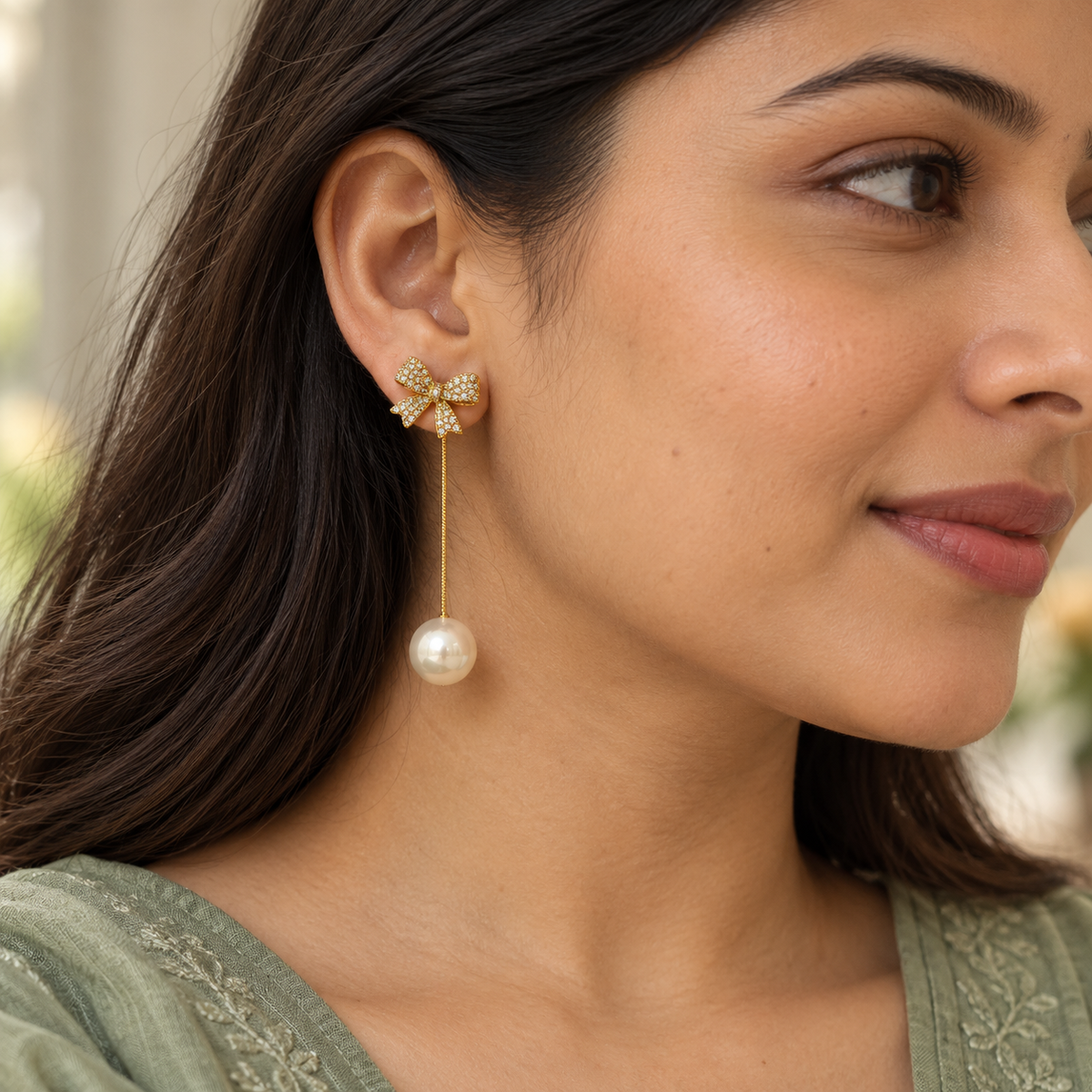 Ivory Pearl Bow Long Drop Earrings — worn by model